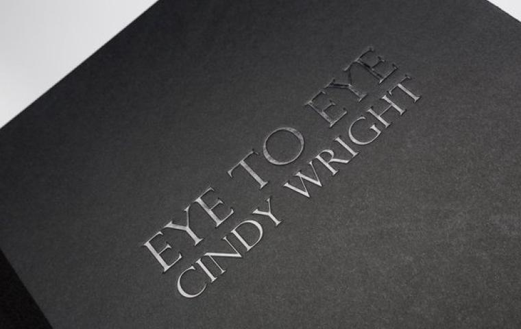 A black cover with the words ‘Eye to eye Cindy Wright’ on it.